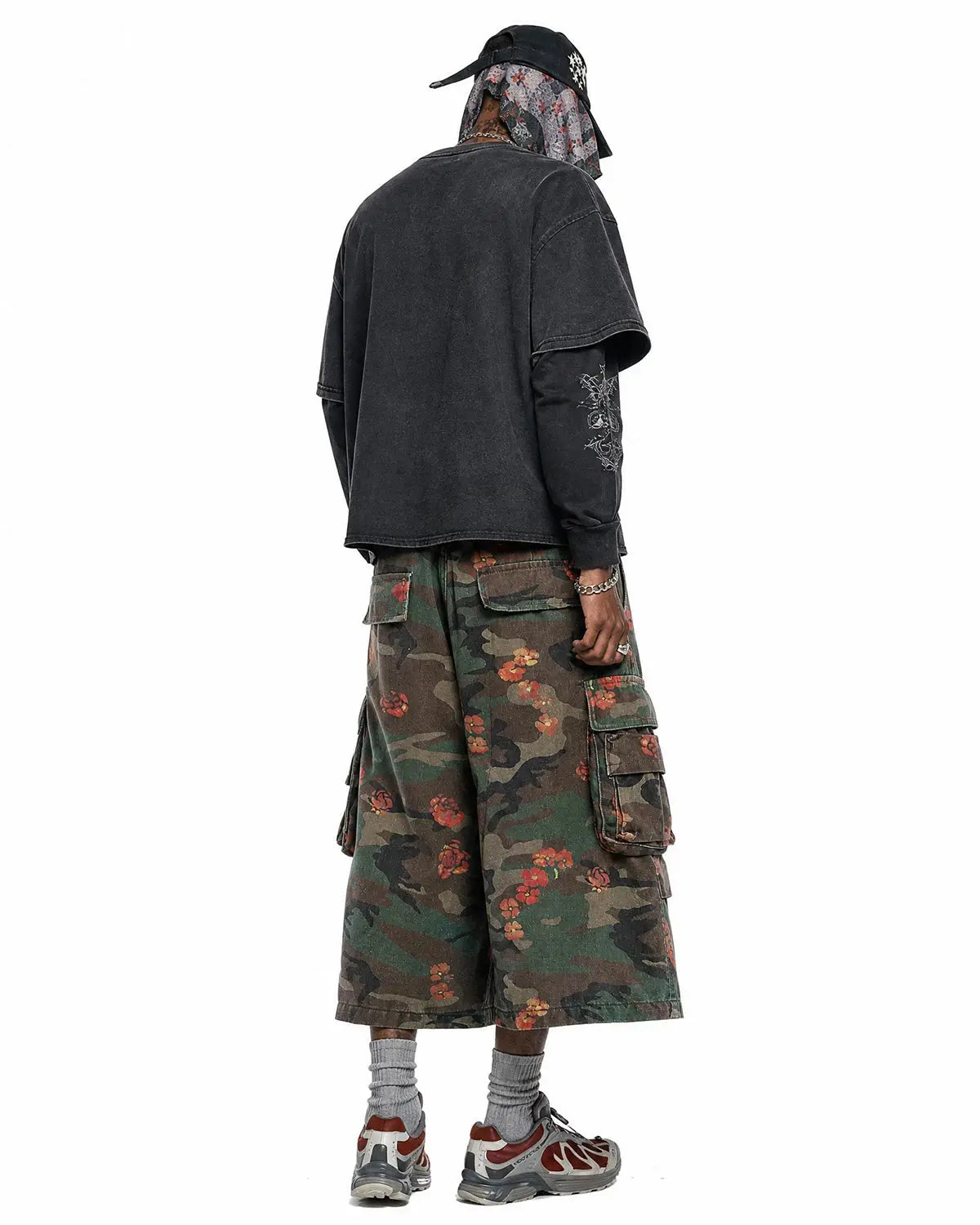 Inflation Floral Camo Cargo Longline Shorts featuring a vibrant floral camouflage pattern and multiple cargo pockets.