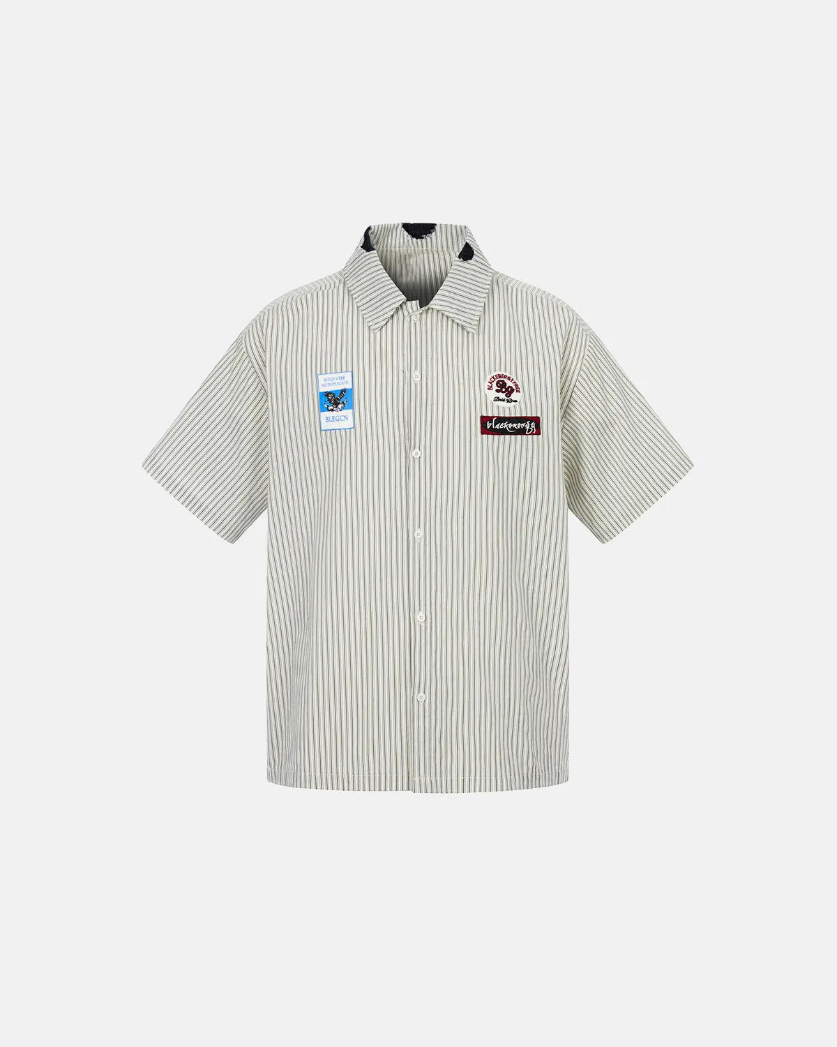 Inflation Streetwear graffiti patch striped shirt featuring bold colors and urban style, displayed on a hanger.