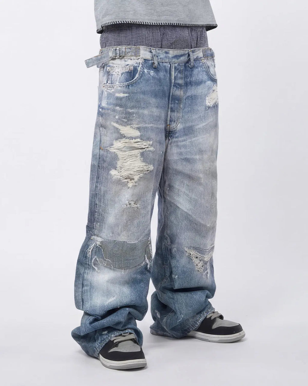 Layered digital print baggy jeans by INFLATION Streetwear featuring bold, colorful design and relaxed fit with layered fabric details.