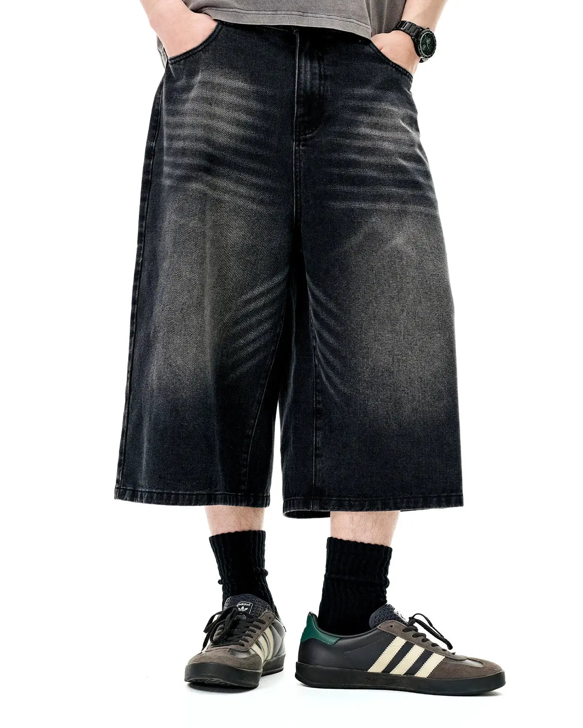 Inflation Streetwear washed baggy longline jorts, casual pants with a relaxed fit and distressed denim look, front view.