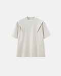 Deconstructed oversized T-shirt by INFLATION, featuring relaxed fit and unique layered design, styled on a model.