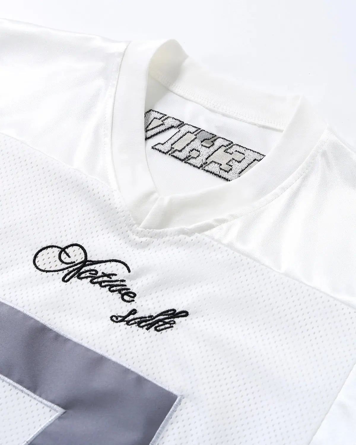 Inflation Mesh Patchwork Number Jersey featuring a vibrant, sporty design with mesh fabric and bold number details.