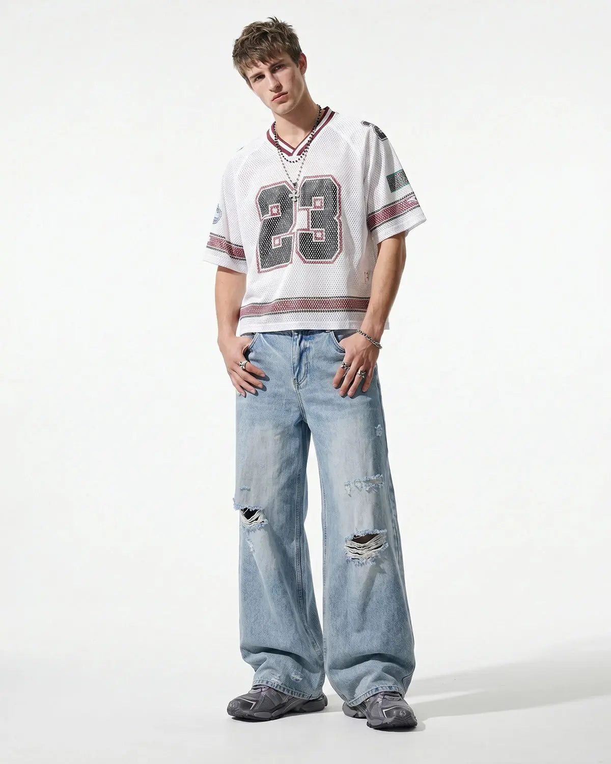 Inflation Double Waist Distressed Baggy Jeans with ripped details and relaxed fit, styled for streetwear fashion.