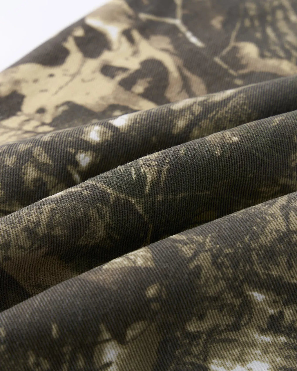 Pink embroidered camo baggy pants by INFLATION, featuring a relaxed fit and detailed embroidery for stylish streetwear.