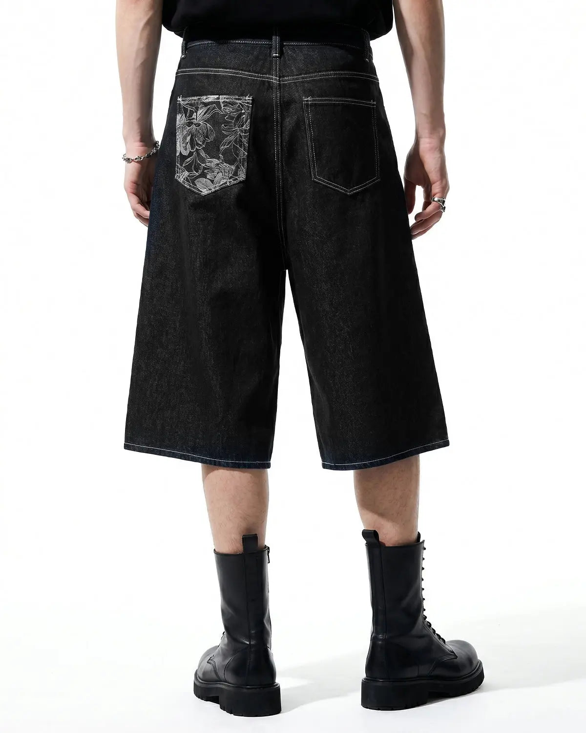 Baggy denim jorts with embroidered pocket from INFLATION, casual streetwear pants featuring distressed denim and colorful embroidery.