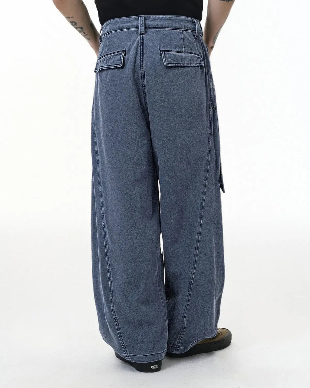 Inflation streetwear baggy cargo pants with multiple pockets and relaxed fit, shown in a casual streetwear style.