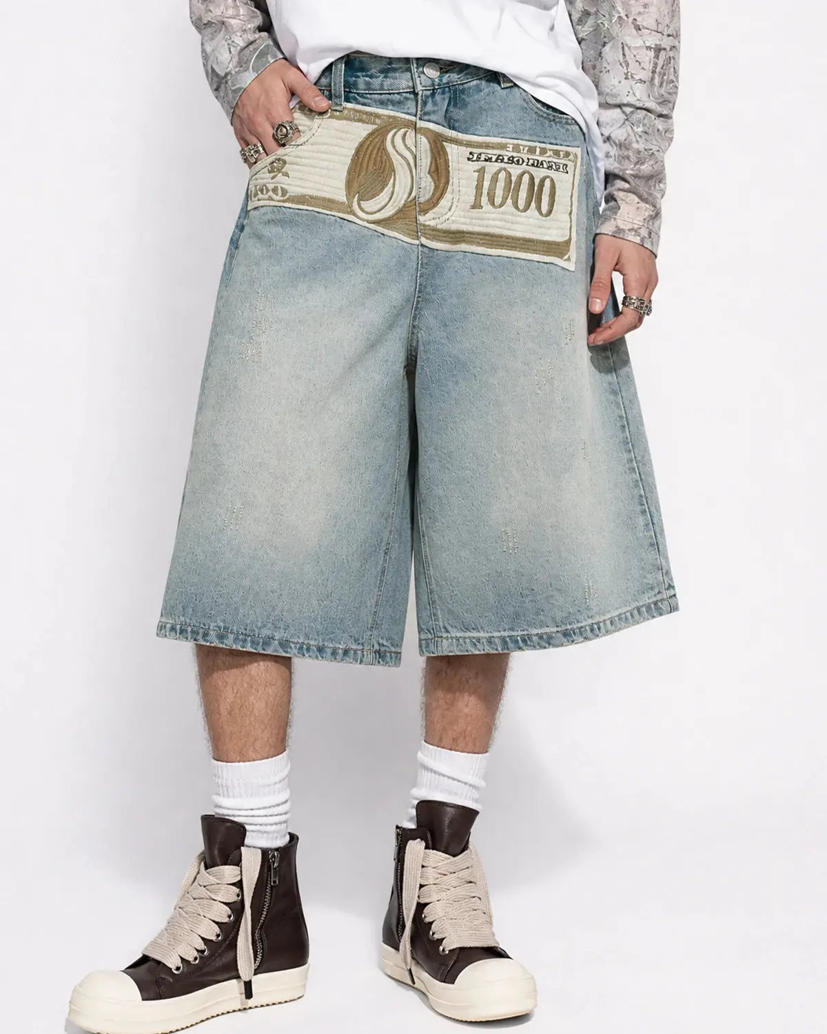 Inflation Dollar Patch embroidery denim jorts with distressed style, showcasing patch details and frayed hem on casual streetwear shorts.