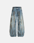 Distressed barrel jeans from Inflation Streetwear featuring a dirty wash finish and relaxed fit, stylish and rugged denim design.