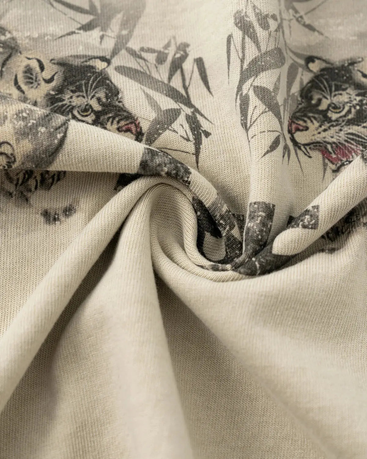 Vintage washed oversized graphic T-shirt by INFLATION, featuring distressed design and relaxed streetwear style.