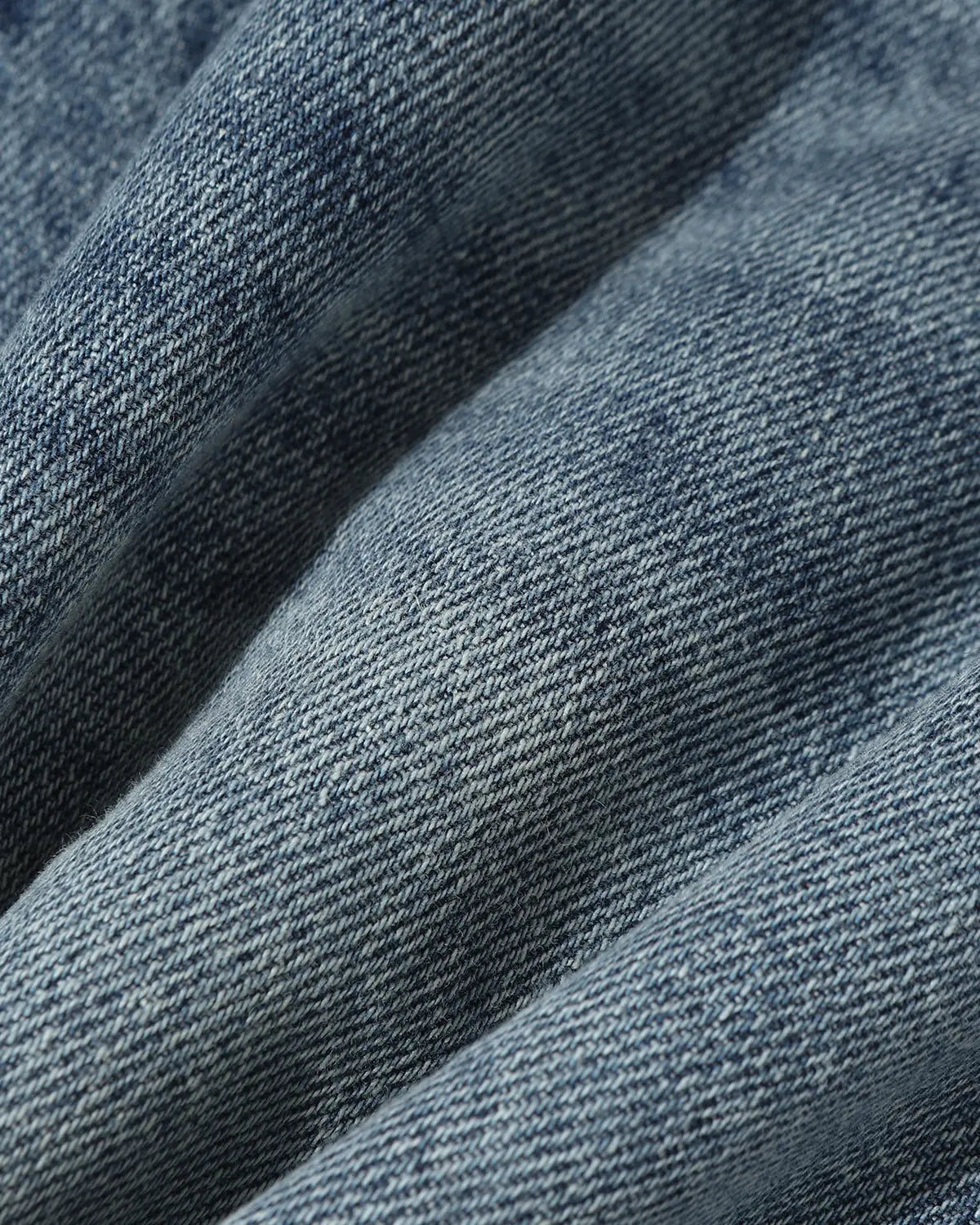 Distressed baggy jorts with adjustable waist tabs by INFLATION, featuring a relaxed fit and rugged denim style.