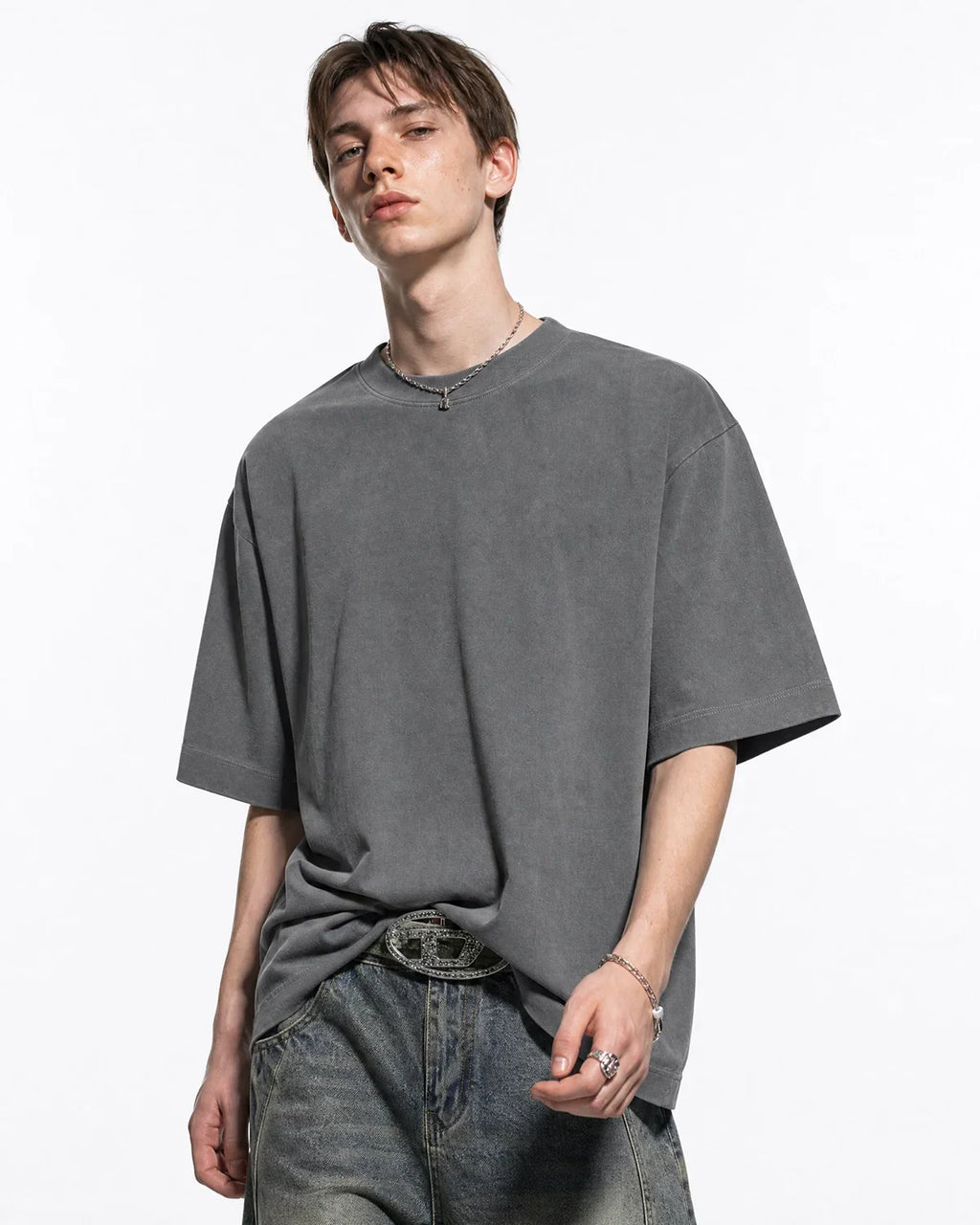 Acid washed cotton T-shirt by INFLATION featuring a relaxed fit and vintage style, shown in a close-up of the fabric texture.