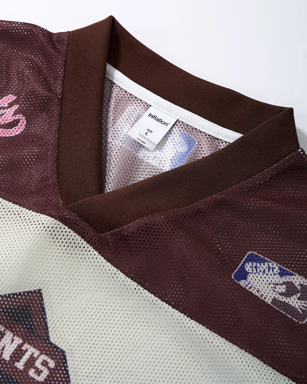 Retro graphic mesh jersey t-shirt by INFLATION with vibrant streetwear-inspired print and breathable mesh fabric.