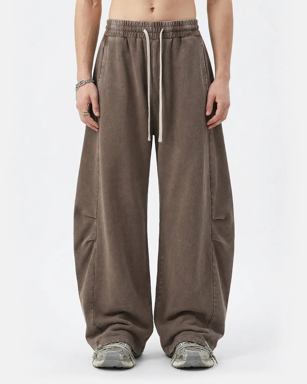 Distressed acid washed barrel sweatpants by INFLATION Streetwear, showing the faded, worn denim-style fabric and relaxed fit.