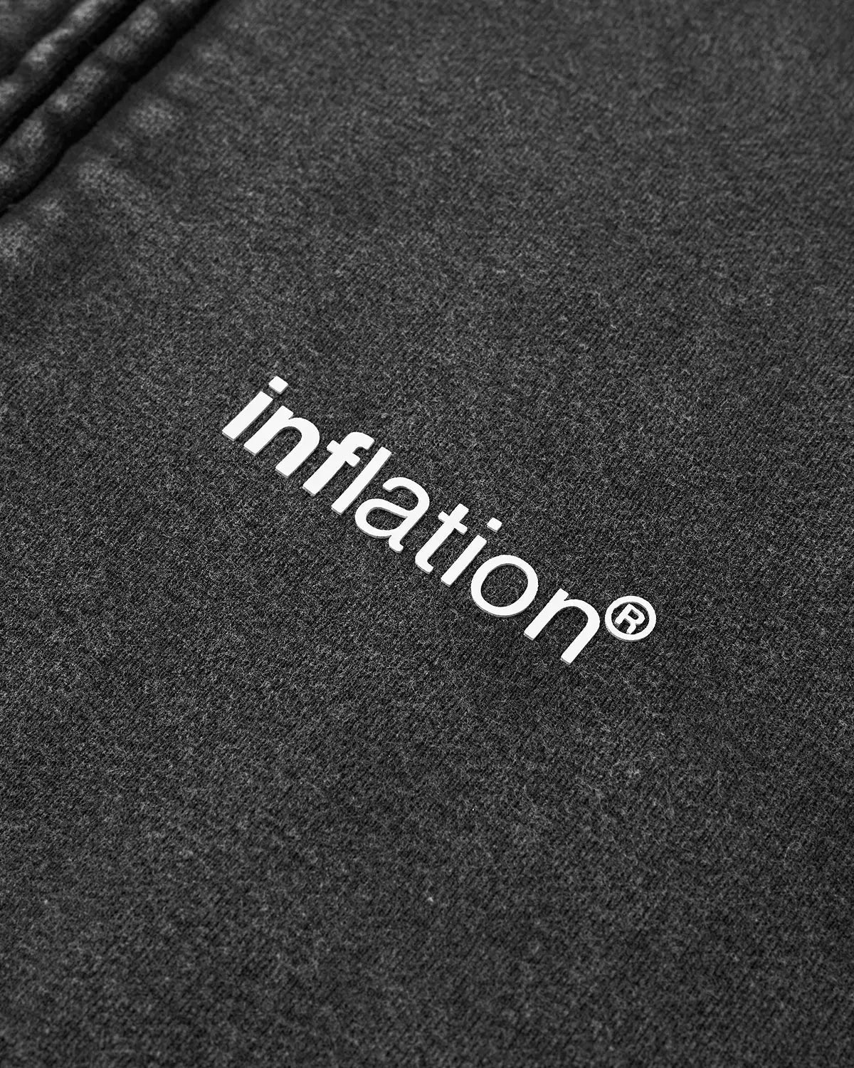 Inflation Streetwear acid washed fleece zip-up hoodie with a front pocket and adjustable drawstrings, shown in a relaxed fit.