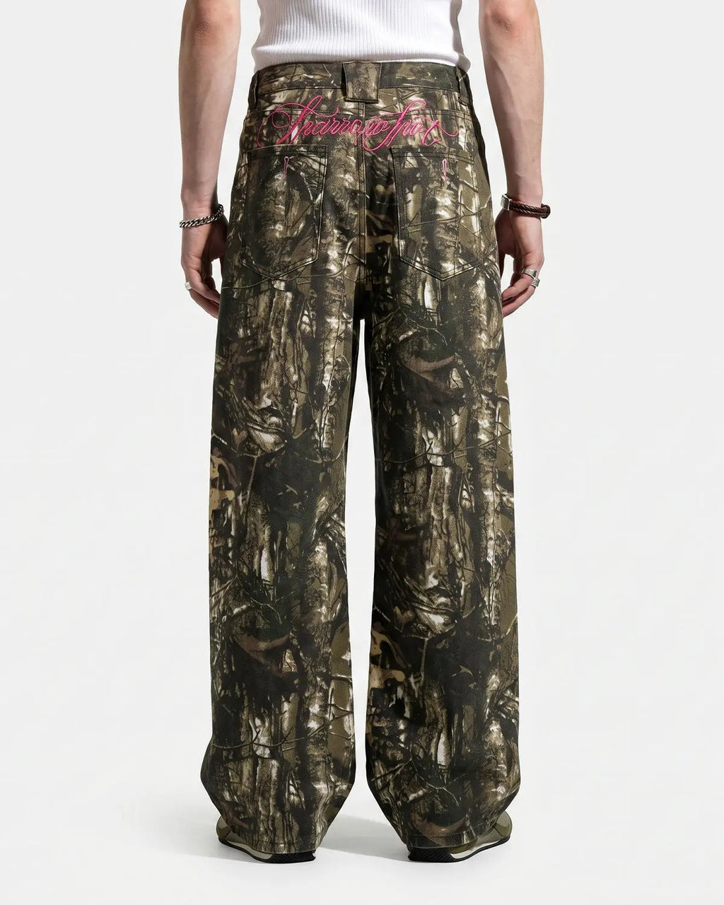Pink embroidered camo baggy pants by INFLATION streetwear, featuring bold camouflage pattern and detailed embroidery.