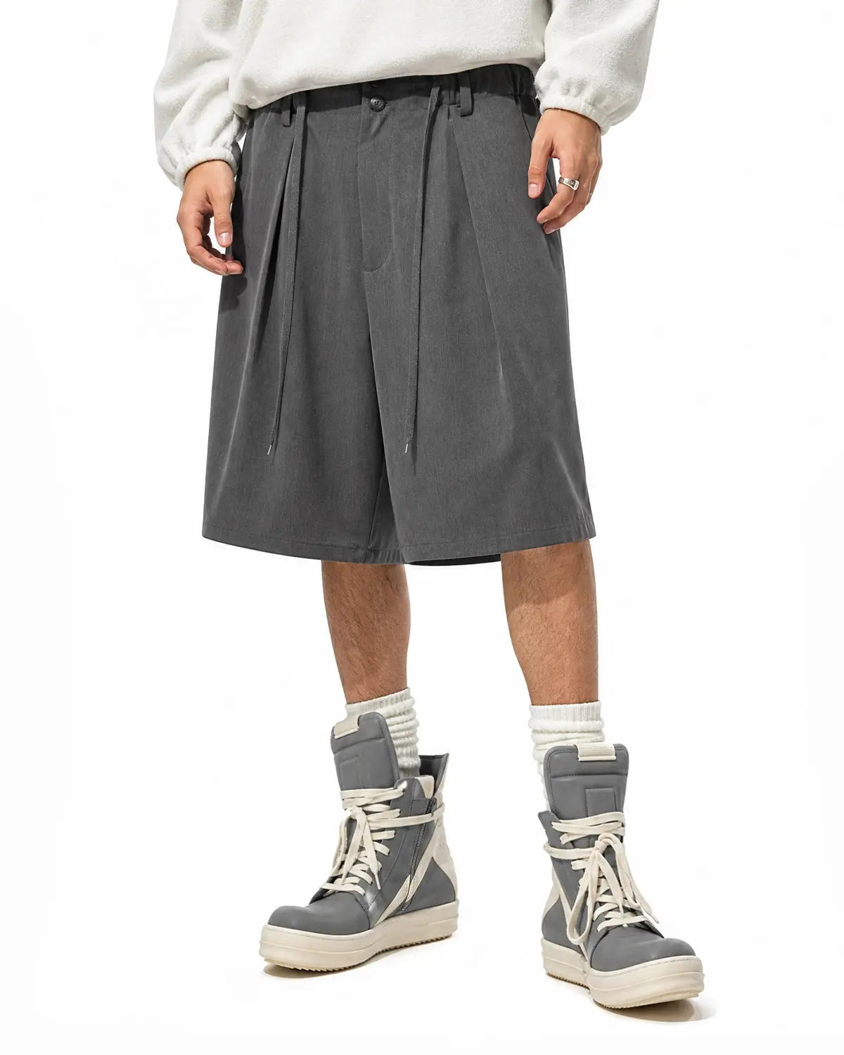 Inflation Streetwear drawstring wide-leg tailored shorts in black, featuring a relaxed fit and adjustable waist for casual style.