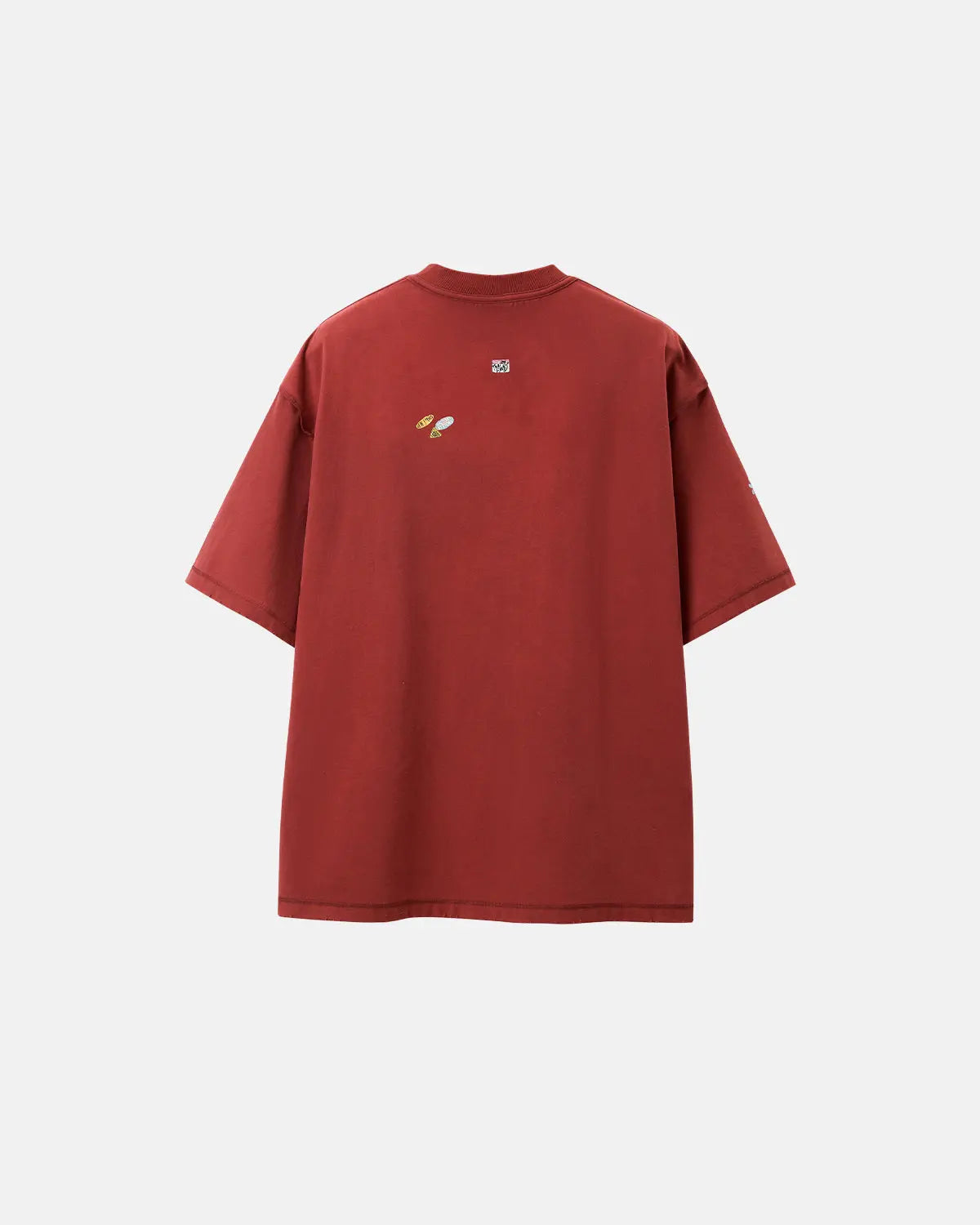 Vintage sticker graphic oversized T-shirt by INFLATION featuring bold retro-inspired patch designs on soft cotton fabric.