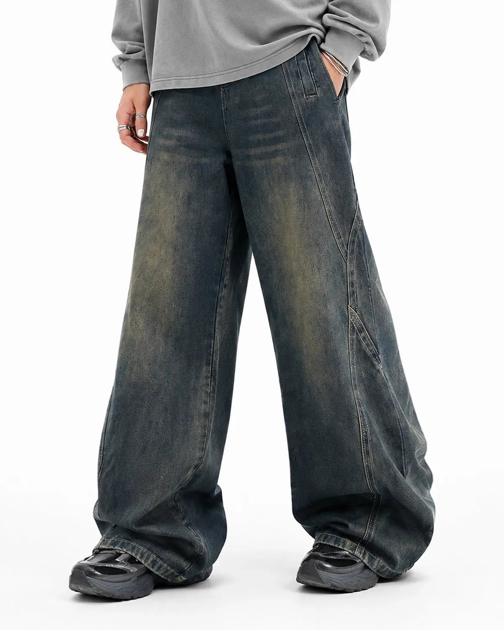Deconstructed straight-leg jeans by INFLATION Streetwear, showing distressed denim with frayed hems and relaxed fit.