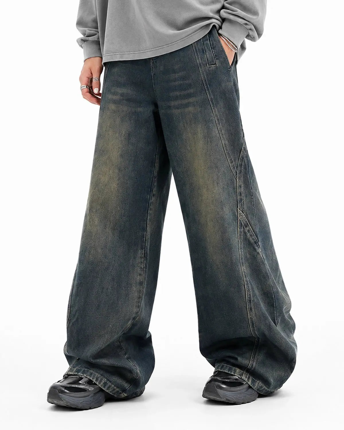 Deconstructed straight-leg jeans by INFLATION Streetwear, showing distressed denim with frayed hems and relaxed fit.