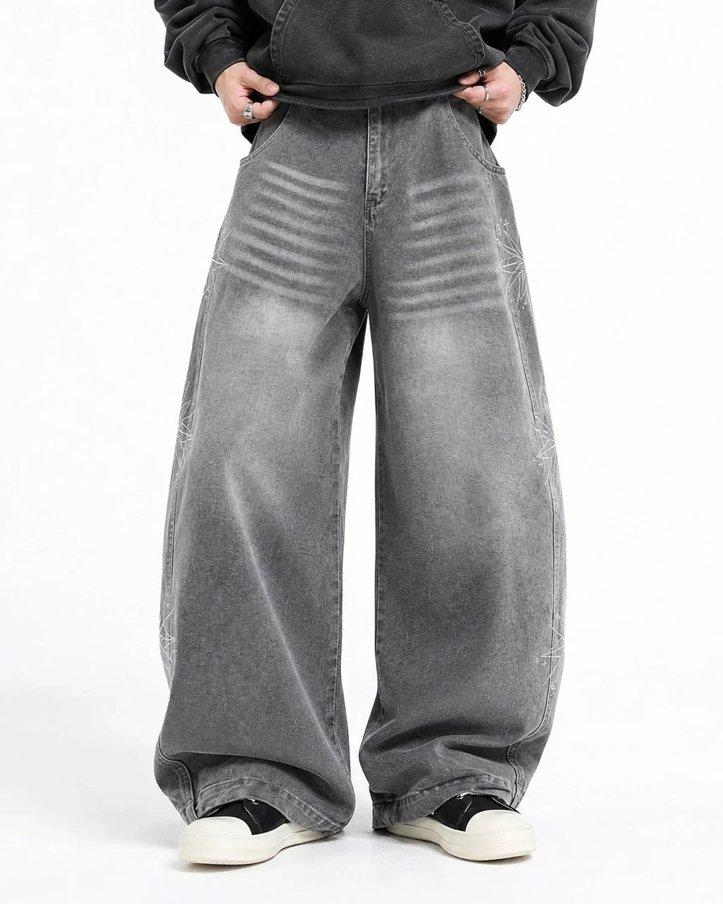 Inflation Star Graphic Rhinestone Barrel Baggy Jeans showing the distressed denim fabric, star designs, and rhinestone embellishments.