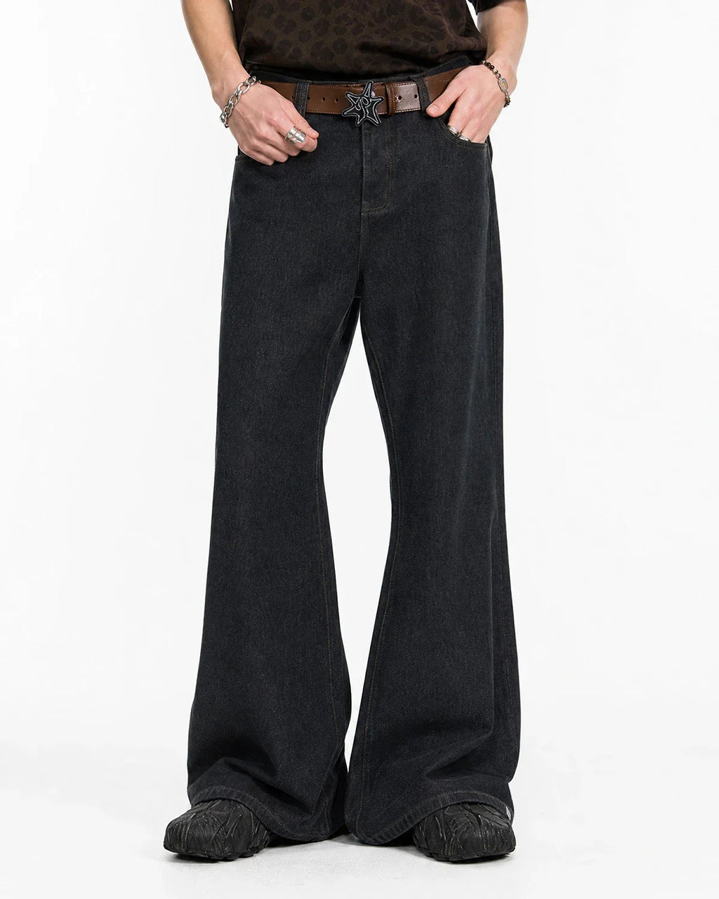 Inflation Super Raw Flared Baggy Jeans with distressed details, high-rise fit, and wide leg silhouette, styled with casual streetwear.