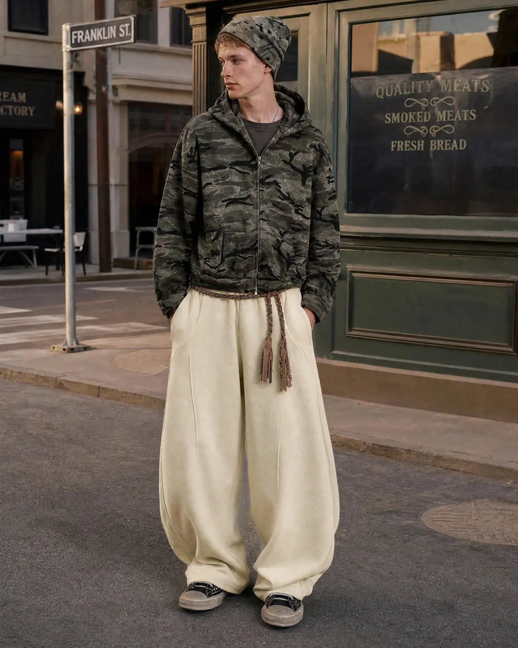 Deconstructed wide-leg sweatpants from INFLATION Streetwear featuring relaxed fit and unique layered design.