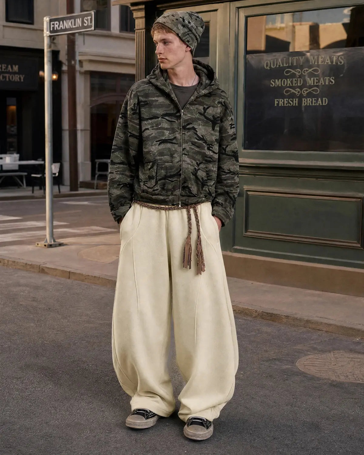 Deconstructed wide-leg sweatpants from INFLATION Streetwear featuring relaxed fit and unique layered design.