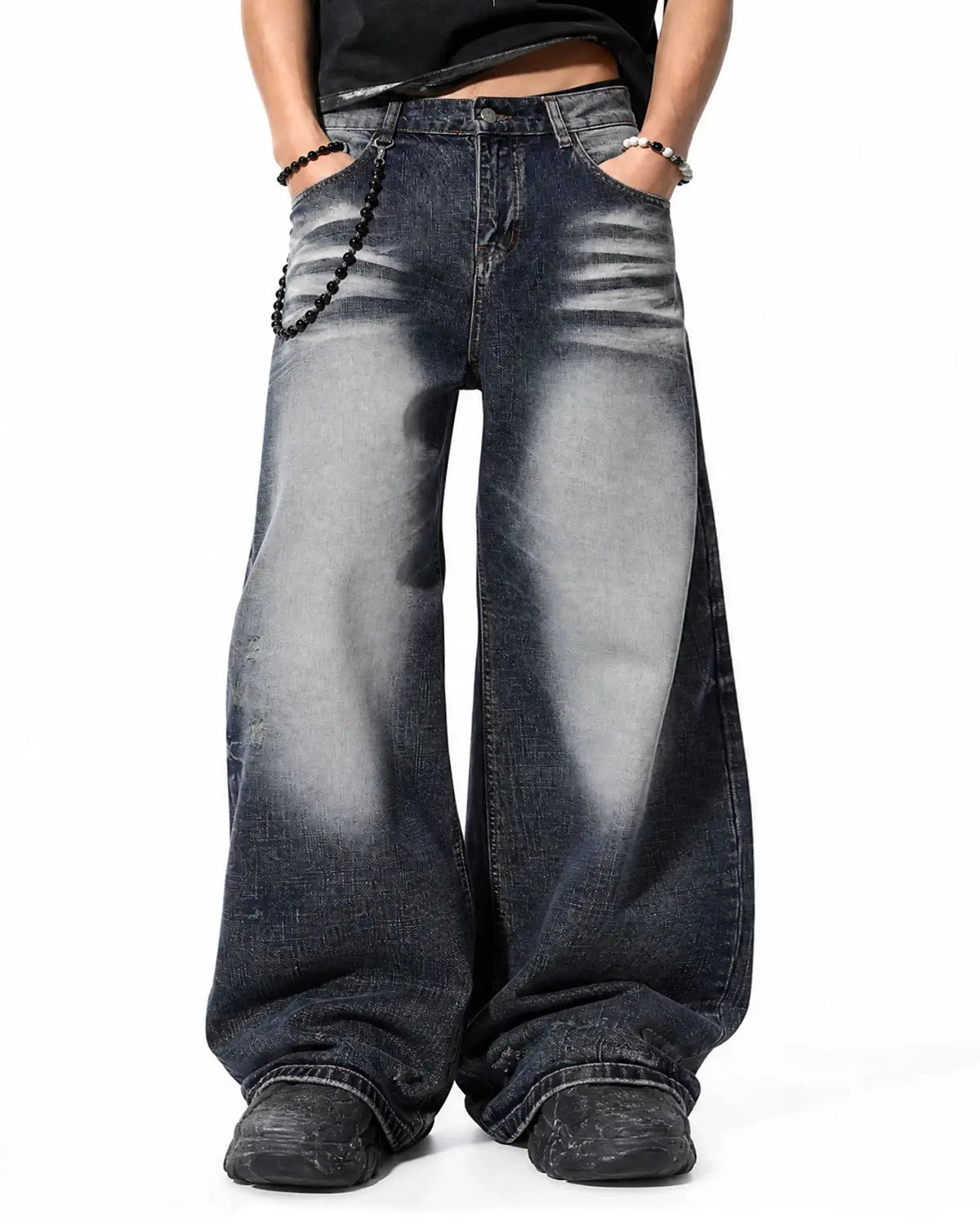 Faded Whisker Baggy Jeans by INFLATION, featuring relaxed fit and distressed details, styled with casual streetwear look.