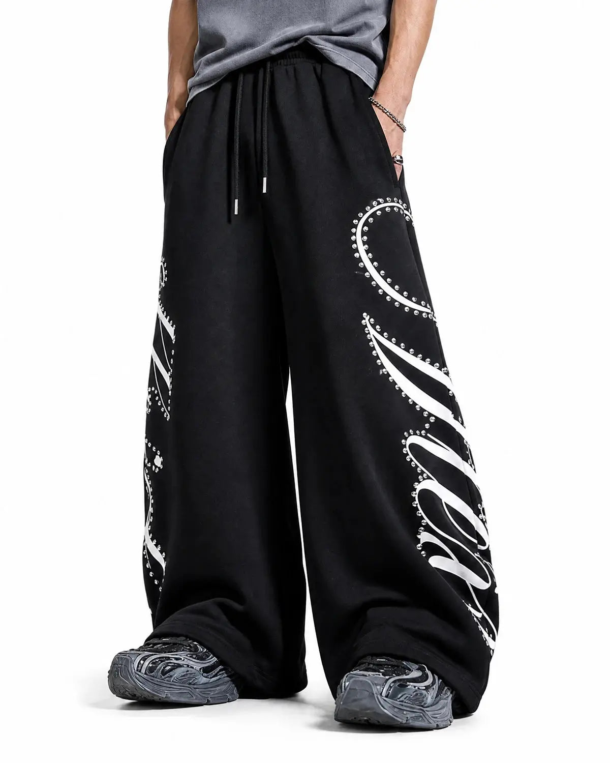 Inflation Streetwear rhinestone script baggy sweatpants with a relaxed fit and stylish embellishments, showcasing casual street style.