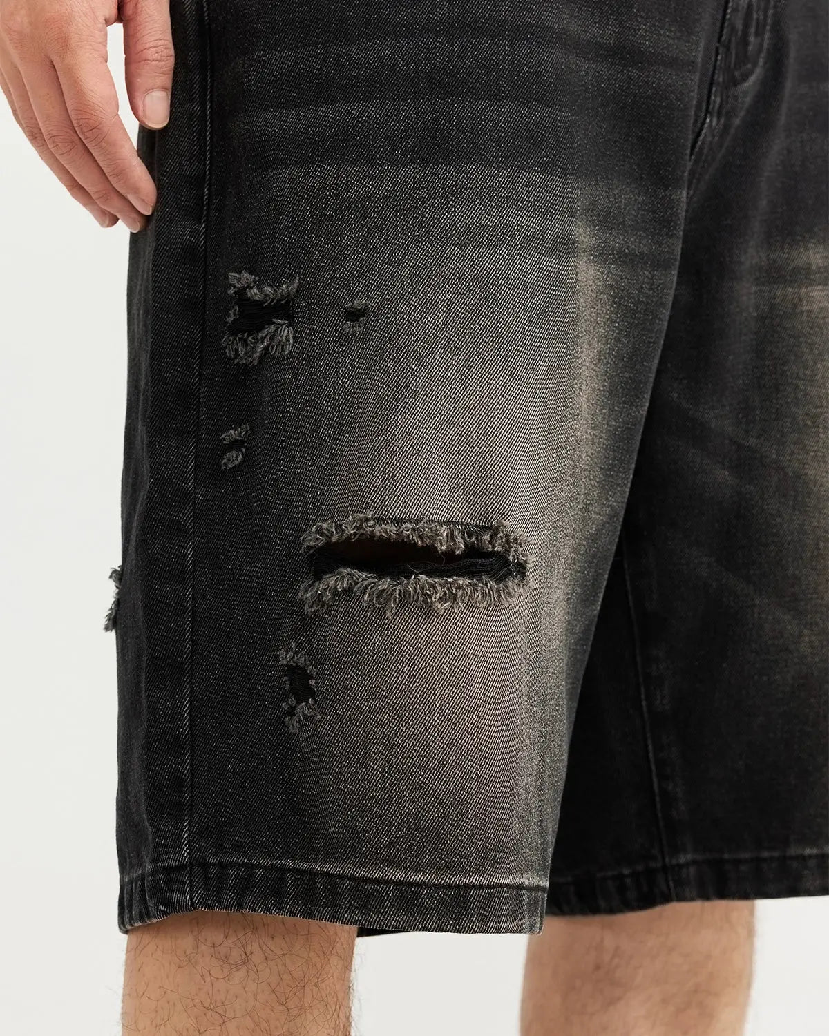 Vintage ripped washed denim jorts from Inflation Streetwear, showing distressed details and frayed hems on light-wash denim.