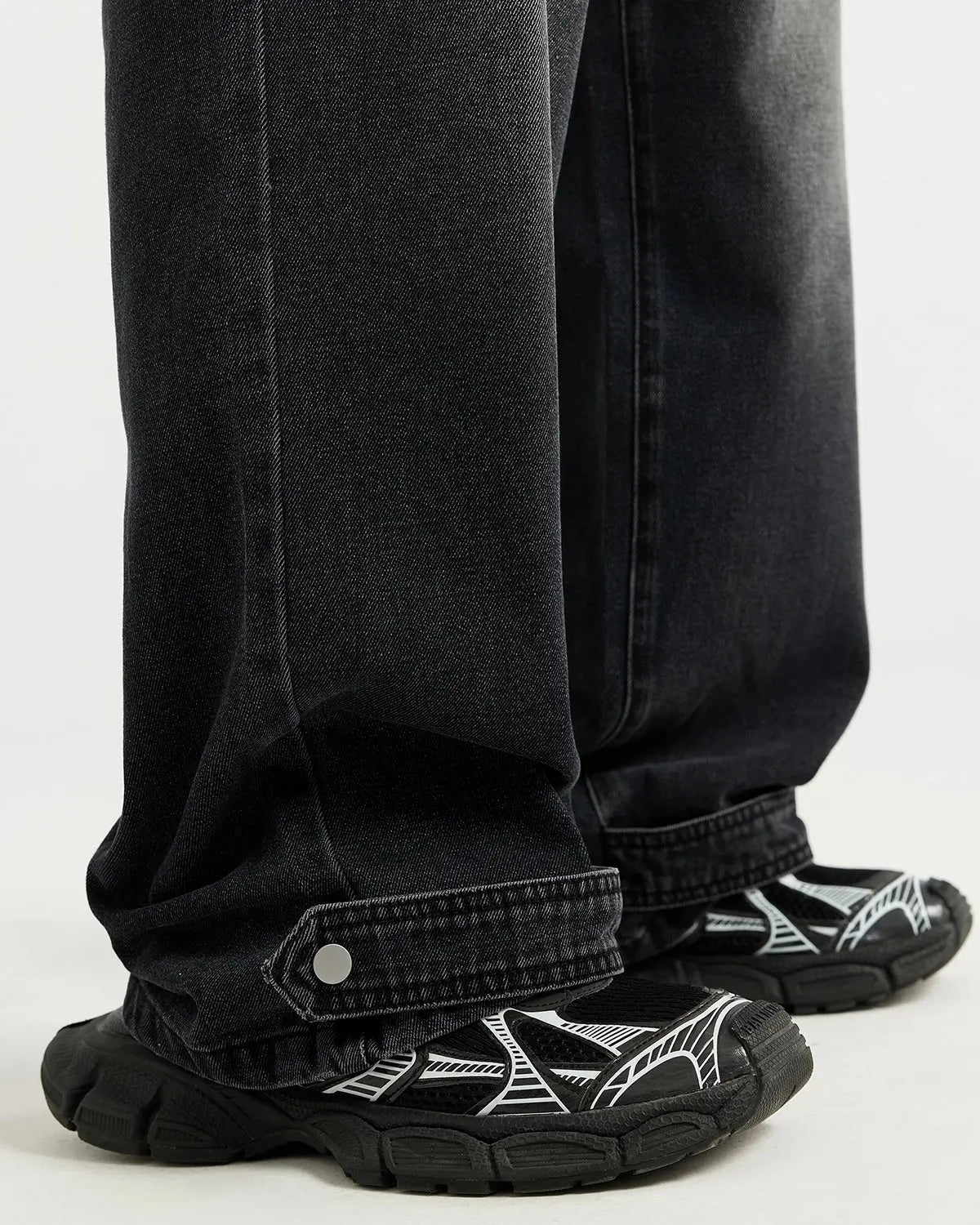 Black washed baggy jeans from Inflation Streetwear featuring a relaxed fit and distressed details.