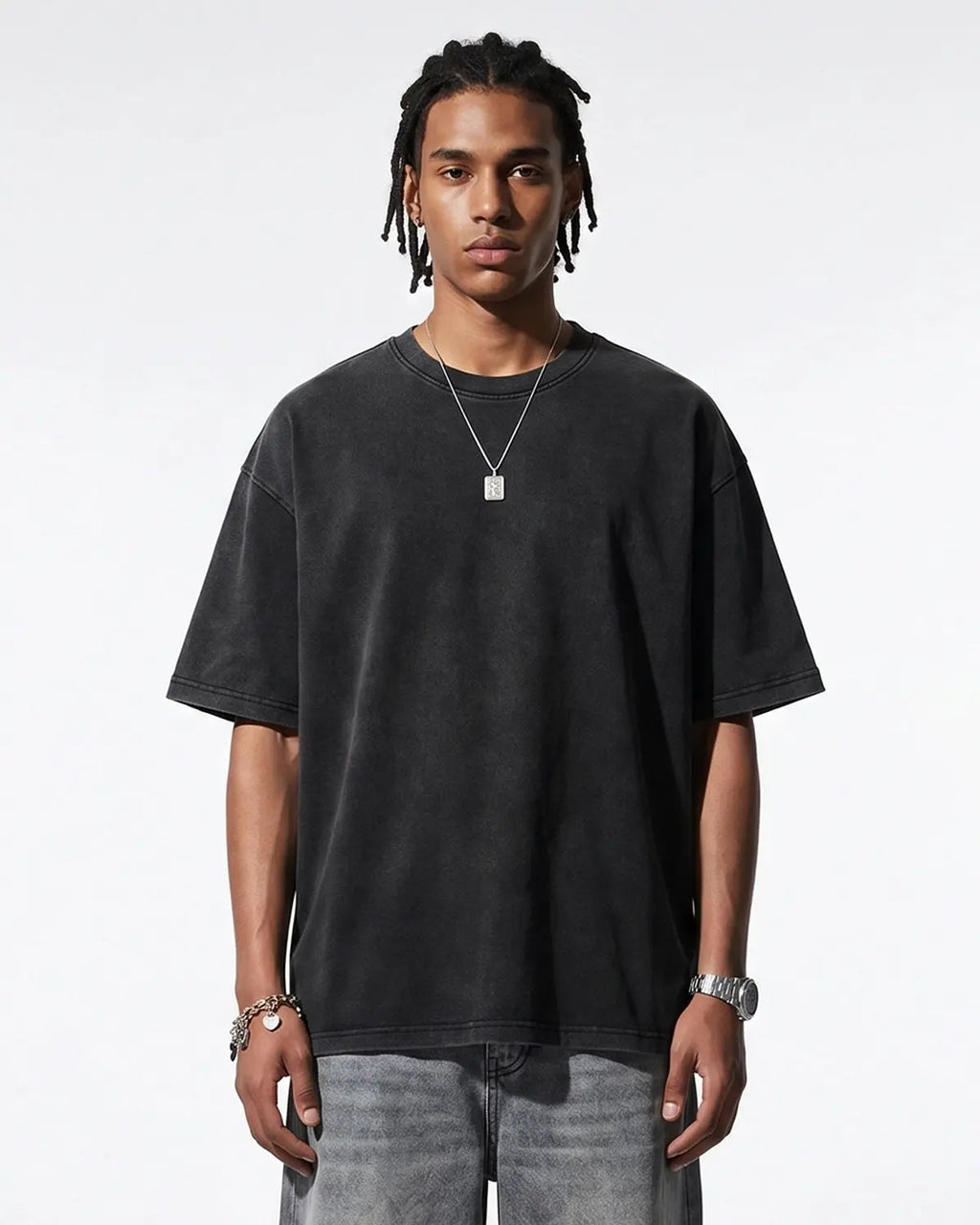Heavyweight oversized washed T-shirt by INFLATION, featuring a relaxed fit and distressed denim wash, laid flat for display.