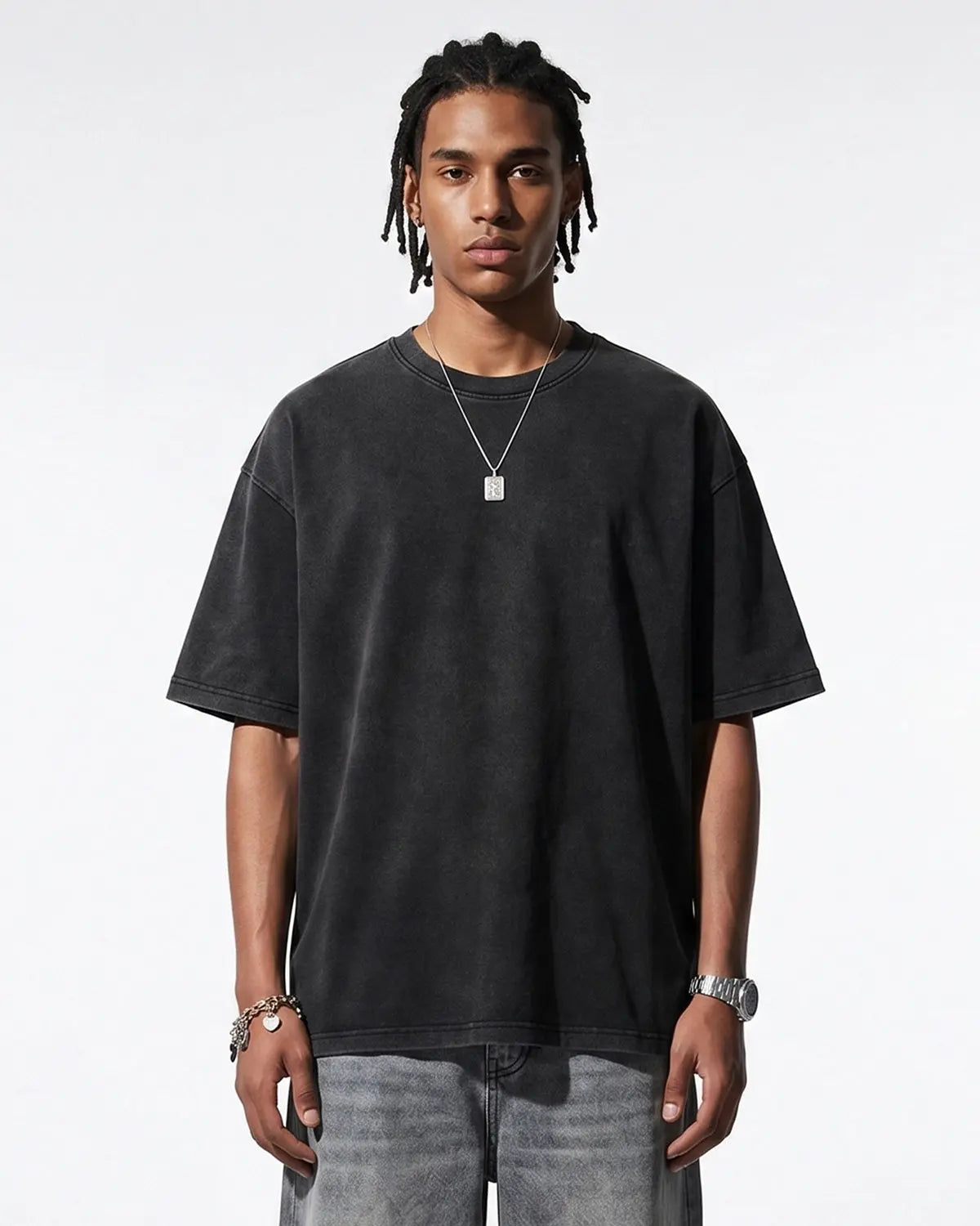 Heavyweight oversized washed T-shirt by INFLATION, featuring a relaxed fit and distressed denim wash, laid flat for display.