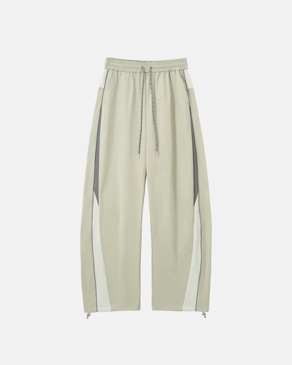 Reflective windbreaker track pants by INFLATION, featuring sporty design and reflective details for active streetwear style.