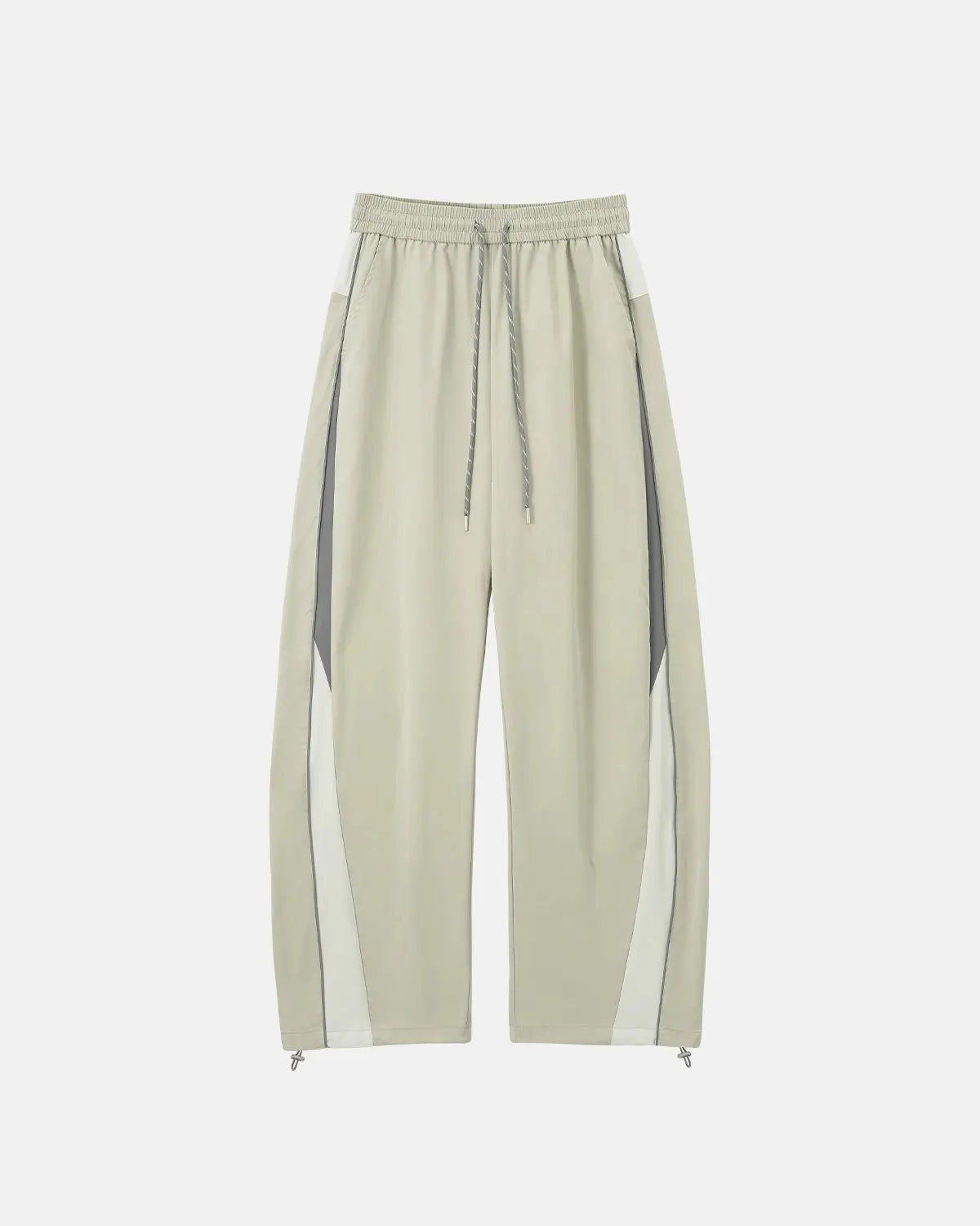 Reflective windbreaker track pants by INFLATION, featuring sporty design and reflective details for active streetwear style.