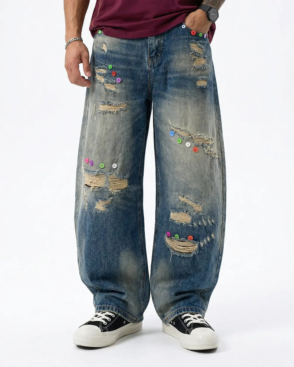 Distressed button barrel jeans by INFLATION featuring a relaxed fit, worn details, and stylish design for streetwear fashion.