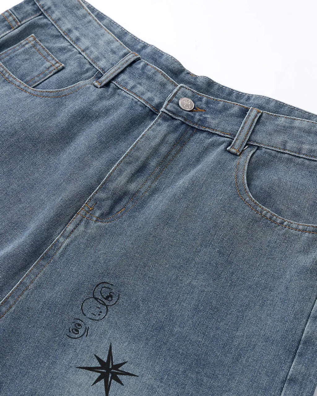 Washed graffiti-style longline jorts by INFLATION, casual streetwear pants with distressed denim and graffiti detailing.