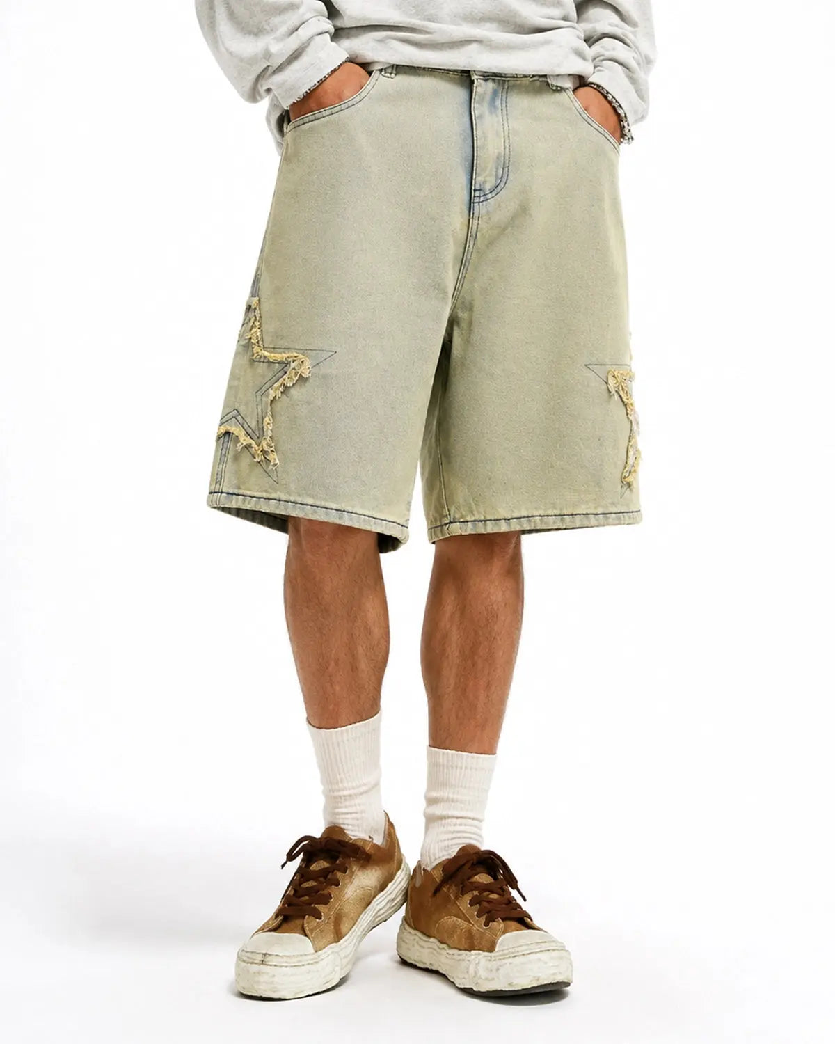 Star patch distressed baggy jorts from INFLATION Streetwear, featuring ripped denim and a relaxed, oversized fit.