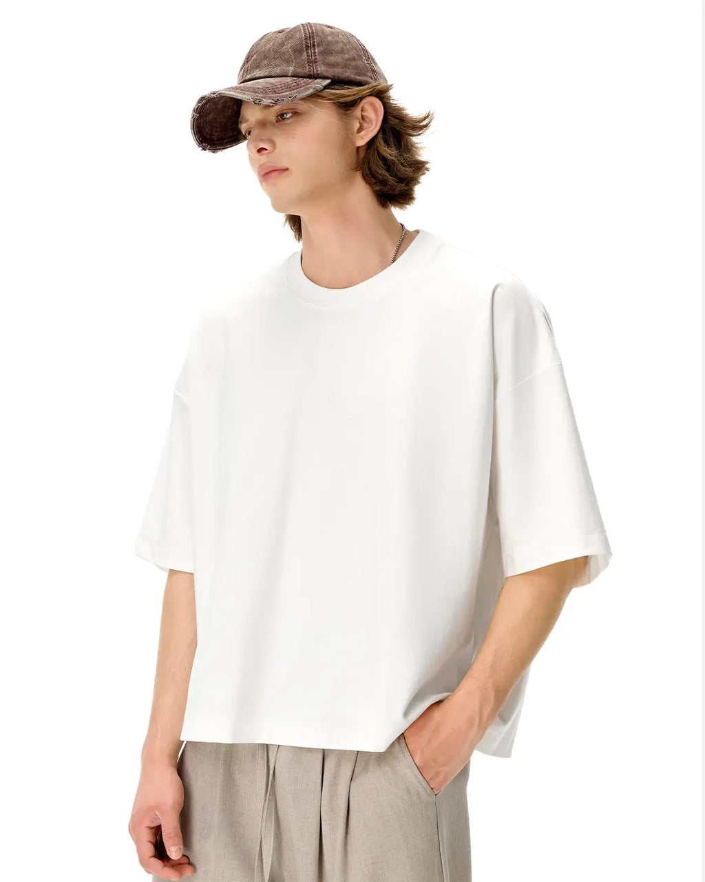 Blank oversized boxy T-shirt by INFLATION, featuring a relaxed fit and minimal design, laid flat on a neutral background.
