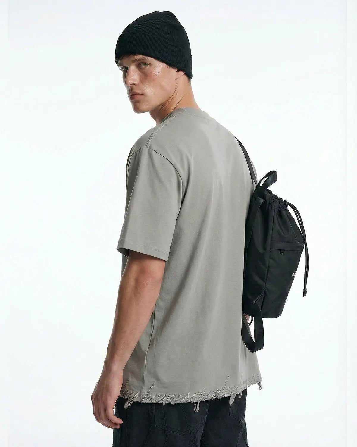 Inflation Streetwear embroidered frayed hem oversized T-shirt, casual fit with detailed embroidery and distressed hem, black color.