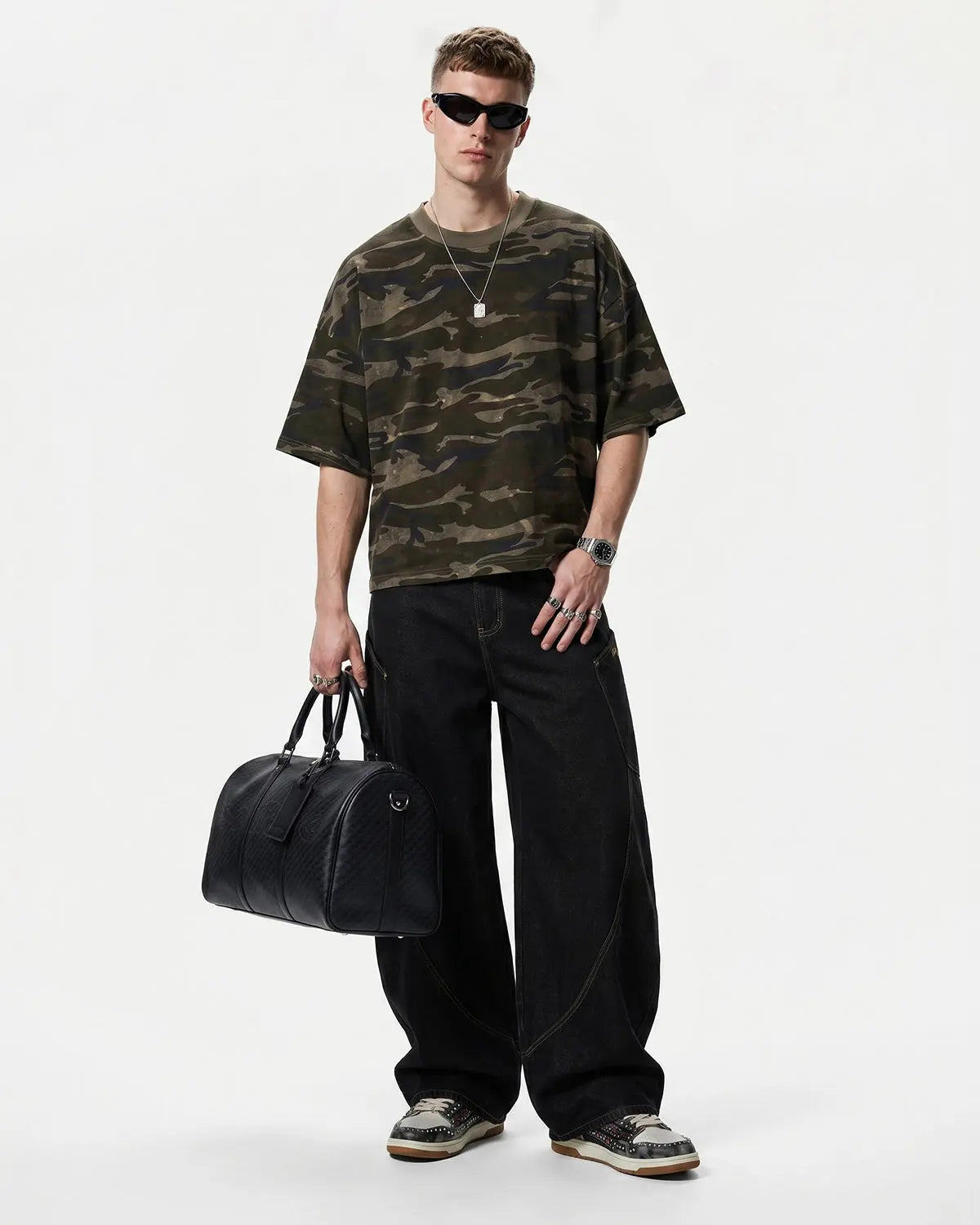 Boxy camo T-shirt by INFLATION, featuring a loose fit and bold camouflage pattern on soft cotton fabric.