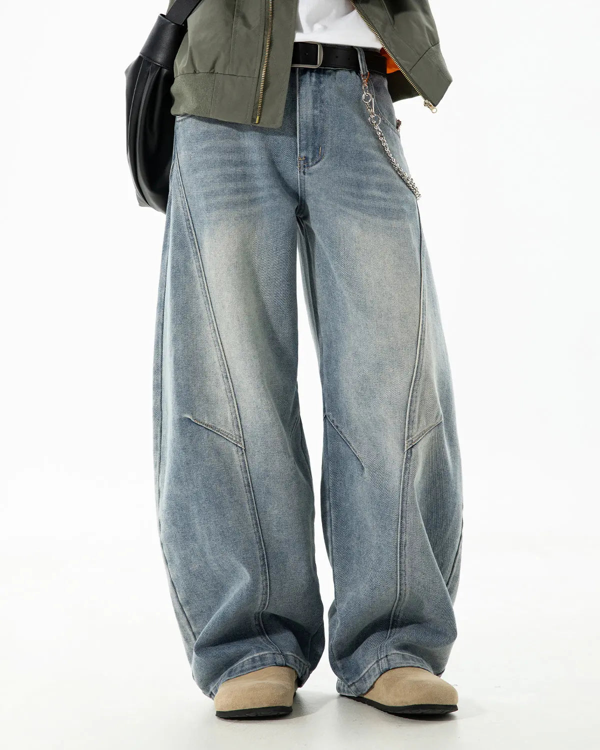 Curved seam deconstructed barrel jeans by INFLATION Streetwear, featuring unique stitching and relaxed fit in denim fabric.