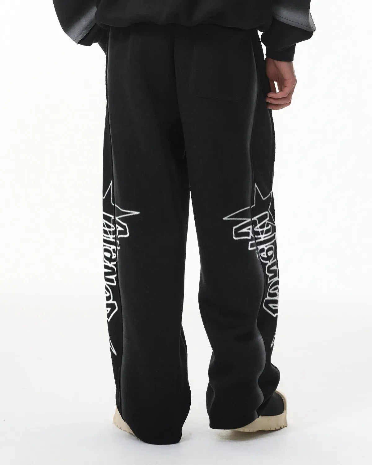 Inflation Streetwear graffiti sweatpant with stitched spray-painted design, showcasing vibrant graffiti-style artwork on soft fabric.