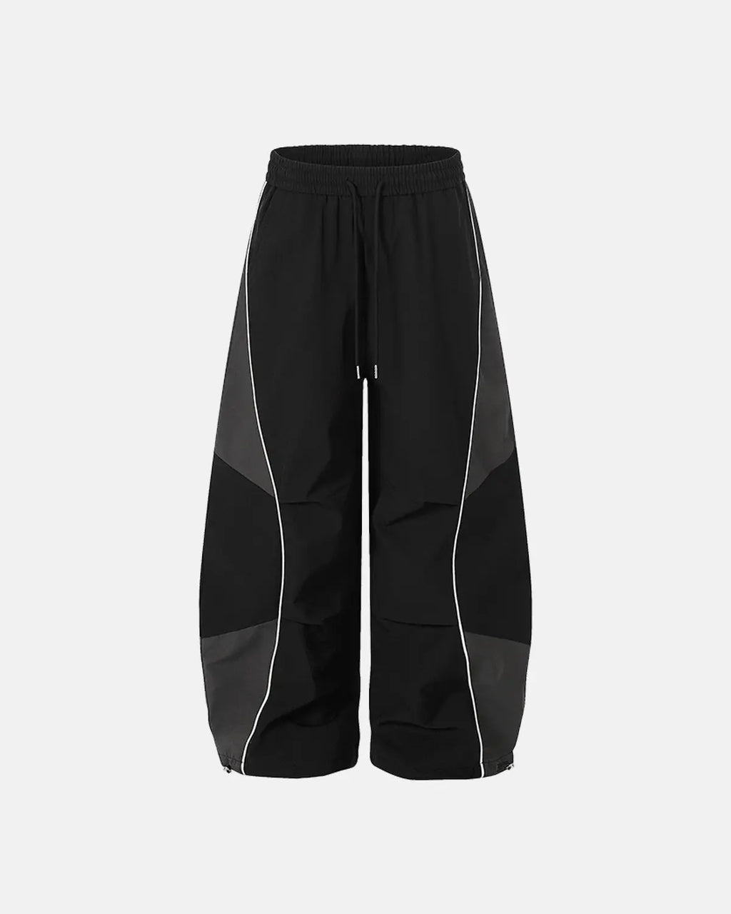 Inflation Streetwear contrast panel baggy track pants with black and white color blocking, relaxed fit, and sporty style.