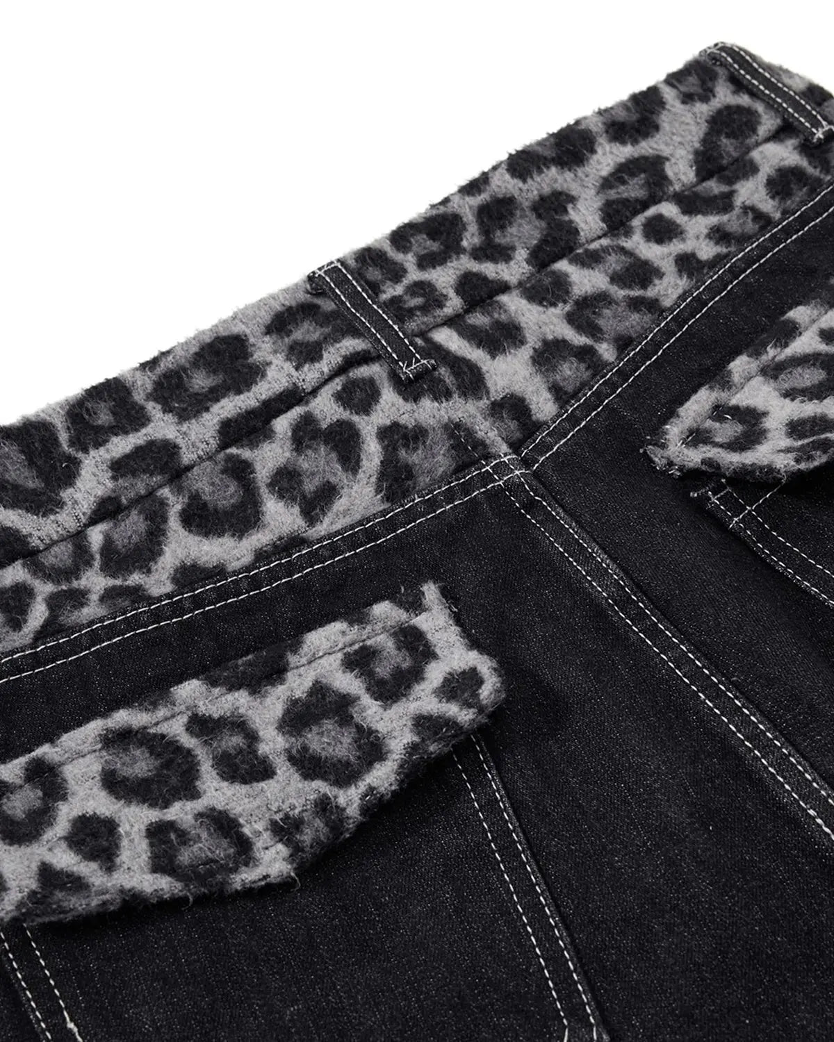 Leopard patchwork raw straight-leg jeans by INFLATION with distressed details and patchwork design on denim fabric.