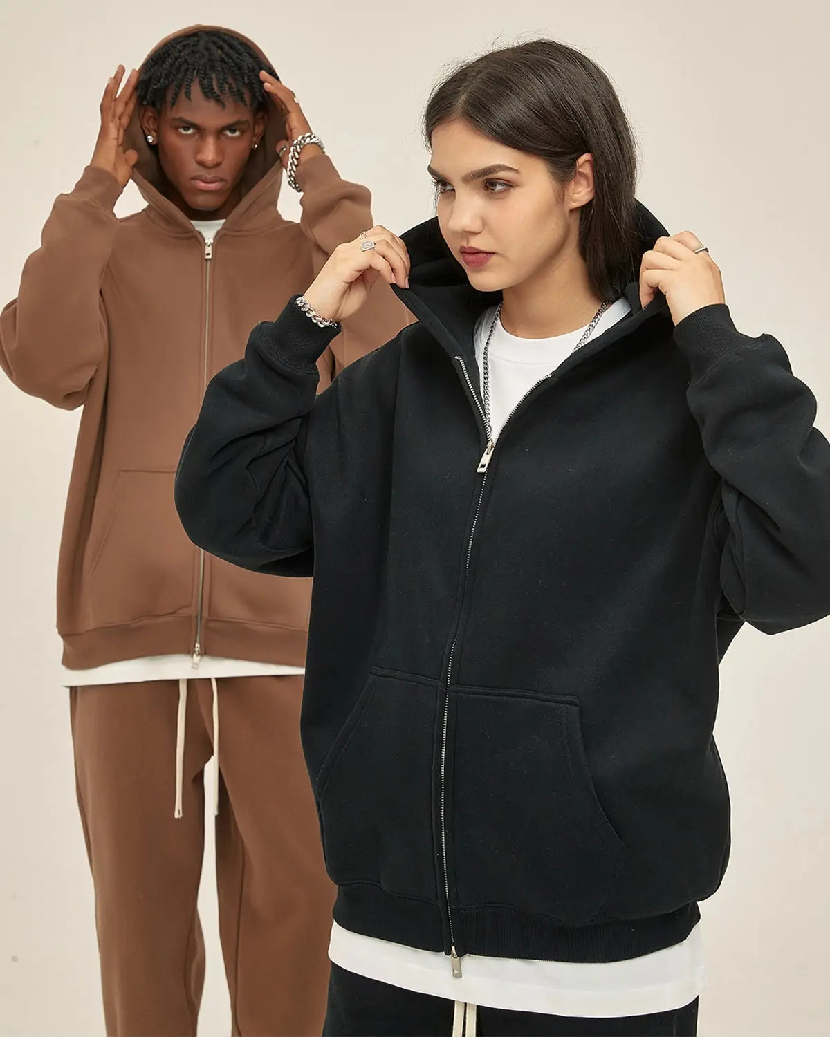 INFLATION fleece double zip-up hoodie jacket with hood, front pockets, and zipper detail, shown in a relaxed fit.