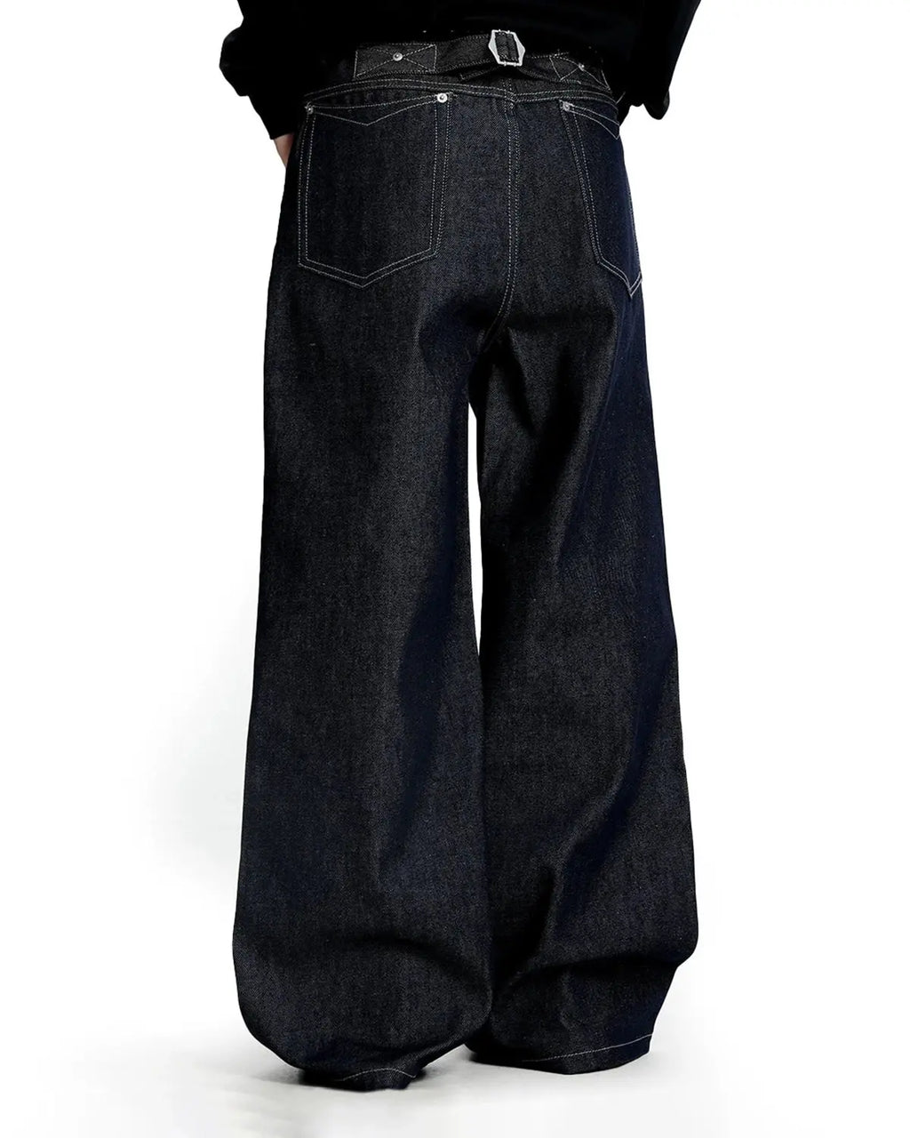 Raw baggy jeans with contrast stitching from Inflation Streetwear, featuring a relaxed fit and distressed denim style.