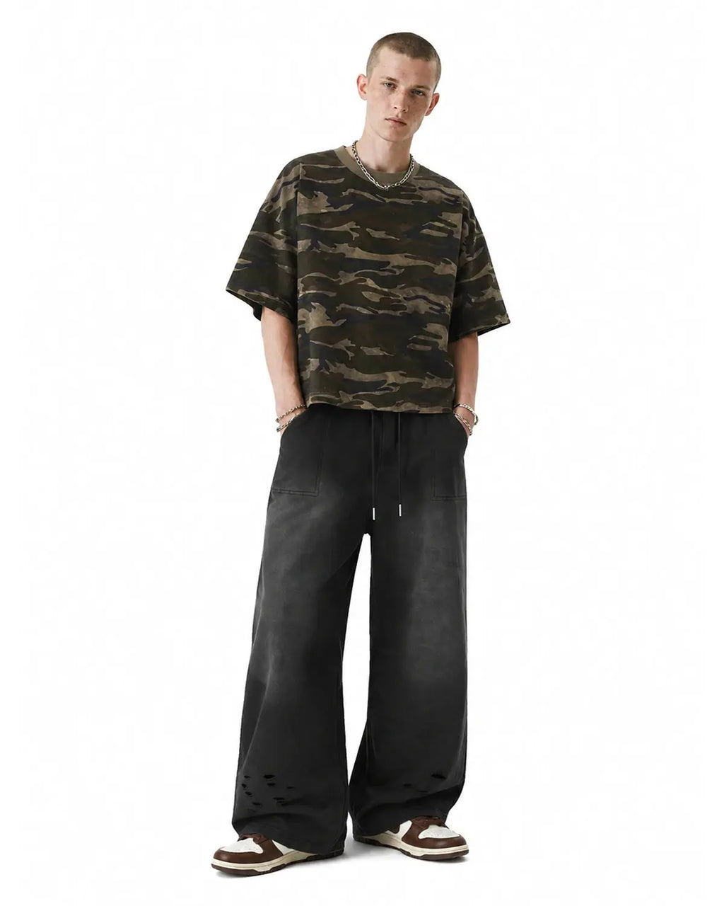 Distressed washed baggy sweatpants by INFLATION, featuring a relaxed fit with ripped and faded details, casual streetwear style.