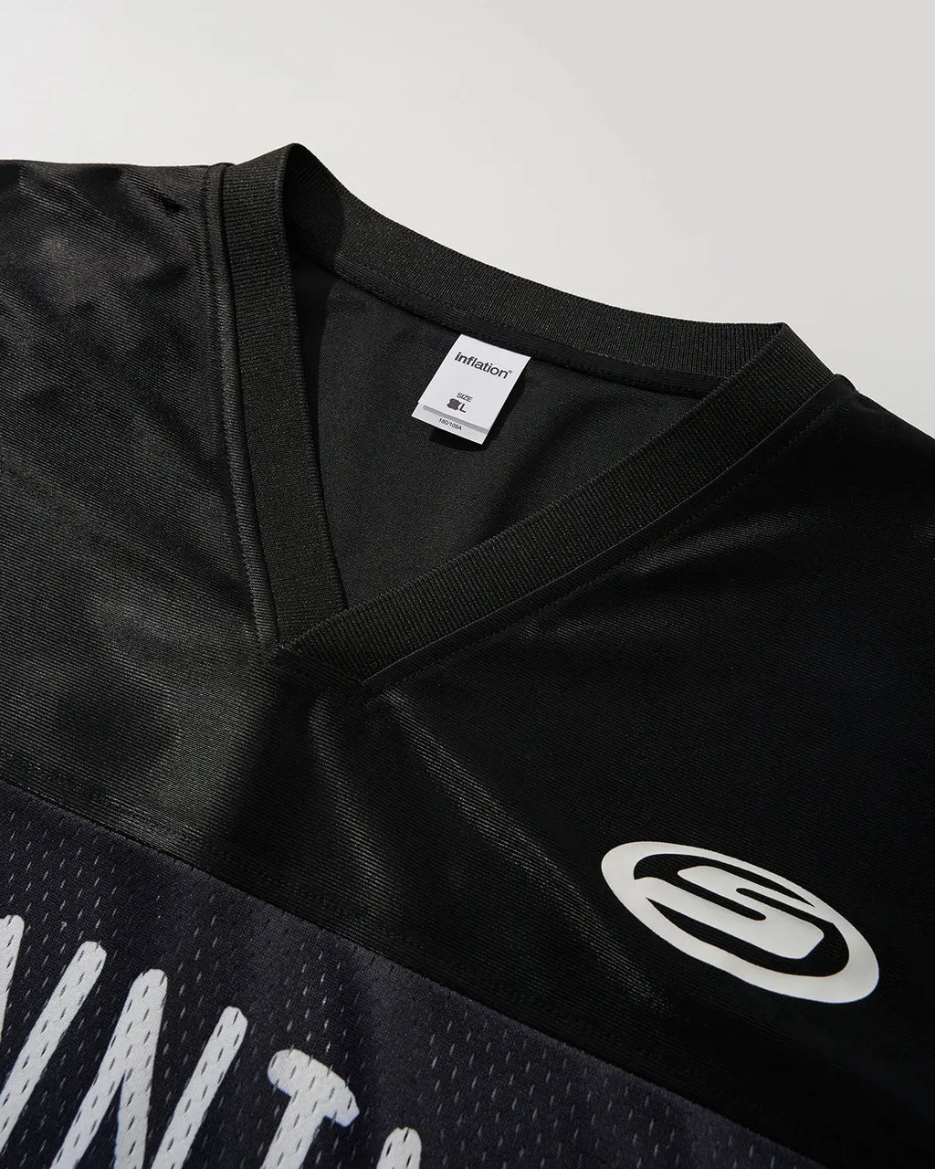 V-Neck Mesh Patchwork Jersey Tee by INFLATION, featuring a stylish mesh and patchwork design in a streetwear style.