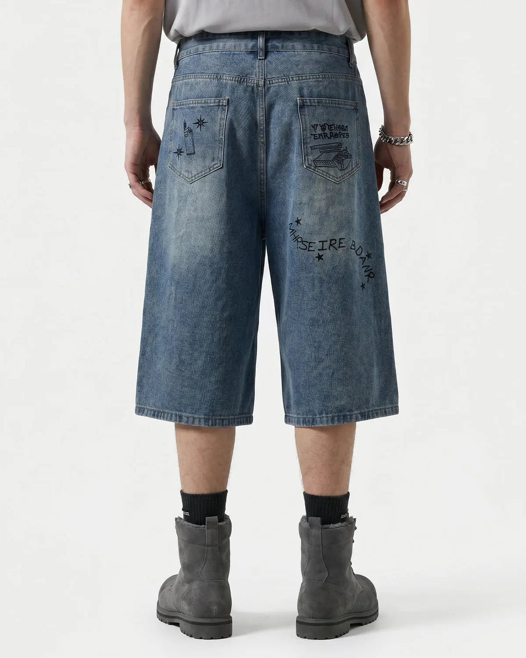 Washed graffiti longline jorts by INFLATION, stylish streetwear pants with a relaxed fit and artistic design.